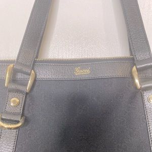 Black Purse with “Gucci” label
